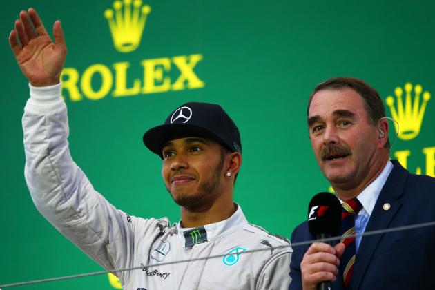 SUZUKA, JAPAN - OCTOBER 05:  Lewis Hamilton of Great Britain and Mercedes GP celebrates following his victory alongside compere Nigel Mansell during the Japanese Formula One Grand Prix at Suzuka Circuit on October 5, 2014 in Suzuka, Japan.  (Photo by Clive Mason/Getty Images)