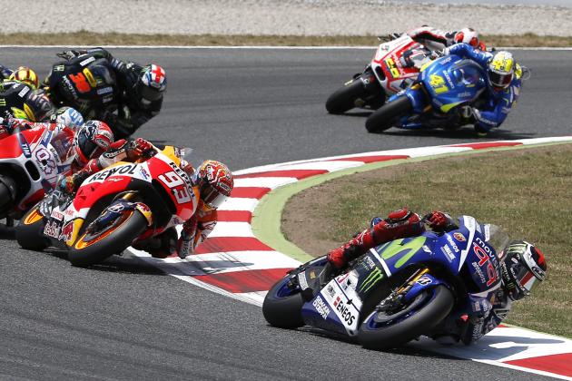 Moto GP rider Jorge Lorenzo of Spain, right, leads the race during the Catalunya Motorcycle Grand Prix at the Barcelona Catalunya racetrack in Montmelo, near Barcelona, Spain, on Sunday, June 14, 2015. (AP Photo/Manu Fernandez)