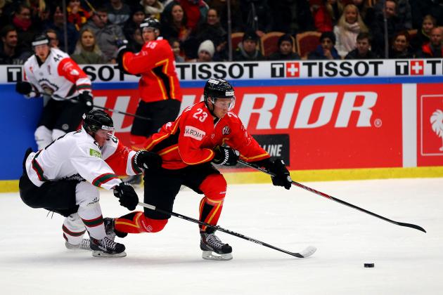 LULEA, SWEDEN - FEBRUARY 03: Lucas Wallmark (R) of Lulea battles for the puck with Erik Karlsson of Gothenburg during the Champions Hockey League final match at Coop Norrbotten Arena on February 3, 2015 in Lulea, Sweden.  (Photo by Martin Rose/Getty Images)
