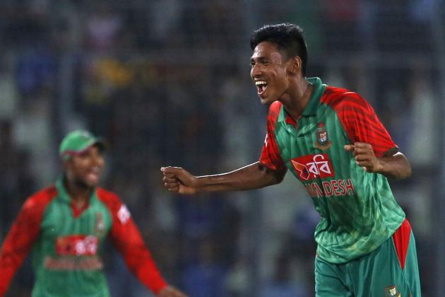 Bangladesh’s Mustafizur Rahman, right, celebrates the dismissal of India’s Rohit Sharma during the first one-day international cricket match between them in Dhaka, Bangladesh, Thursday, June 18, 2015. (AP Photo/ A.M. Ahad)