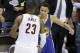 Cleveland Cavaliers forward LeBron James (23) hugs Golden State Warriors guard Stephen Curry (30) during the second half of Game 6 of basketball's NBA Finals in Cleveland, Tuesday, June 16, 2015. The Warriors defeated the Cavaliers 105-97 to win the best-of-seven game series 4-2. (AP Photo/Darron Cummings)