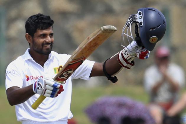 Sri Lanka’s Kaushal Silva raises his bat and helmet after scoring a century during the third day of the first test cricket match against Pakistan at the Galle International Cricket Stadium in Galle, Sri Lanka, Friday, June 19, 2015. (AP Photo/Sanka Gayashan)