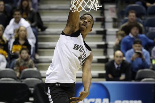 Wofford guard Jeremiah Tate dunks during a practice session for their NCAA college basketball tournament game Wednesday, March 19, 2014, in Milwaukee. Wofford plays Michigan on Thursday, March 20, 2014. (AP Photo/Morry Gash)