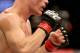 A closeup of the UFC logo on a fighter's gloves at UFC Fight Night Boston, Sunday, January 18, 2015 in Boston. (AP Photo/Gregory Payan)