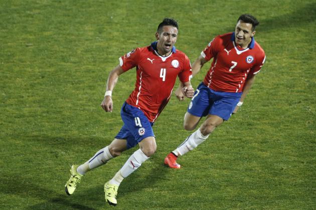 Chile's Mauricio Isla, left, celebrates after scoring against Uruguay with teammate Chile's Alexis Sanchez, right, during a Copa America quarterfinal soccer match at the National Stadium in Santiago, Chile, Wednesday, June 24, 2015. Chile won the match 1-0. (AP Photo/Silvia Izquierdo)