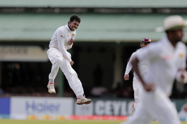 Sri Lanka's Tharindu Kaushal, left, jumps as he celebrates taking five wickets during the first day of the second test cricket match against Pakistan in Colombo, Sri Lanka, Thursday, June 25, 2015. (AP Photo/Eranga Jayawardena)