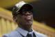 FILE - In this Jan. 8, 2014, file photo, former NBA basketball player Dennis Rodman looks out at the court at the end of an exhibition basketball game with U.S. and North Korean players at an indoor stadium in Pyongyang, North Korea. Rodman checked into an alcohol-rehabilitation center to reevaluate his life, not give up drinking. He spent three weeks in a New Jersey-based facility when he returned from his latest trip to North Korea.(AP Photo/Kim Kwang Hyon, File)