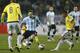 A laser reflects on Argentina's Lionel Messi as he plays the ball during a Copa America quarterfinal soccer match against Colombia at the Sausalito Stadium in Vina del Mar, Chile, Friday, June 26, 2015. (AP Photo/Andre Penner)