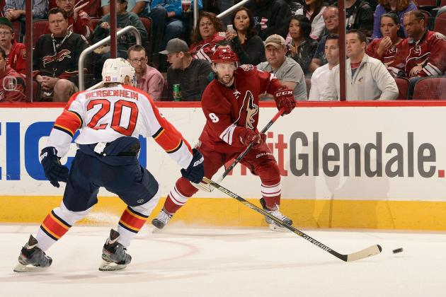 GLENDALE, AZ -  OCTOBER 25: Center Sam Gagner #9 of the Arizona Coyotes passes over left wing Sean Bergenheim #20 of the Florida Panthers during the first period of the NHL game at Gila River Arena on October 25, 2014 in Glendale, Arizona.  (Photo by Norm Hall/NHLI via Getty Images)