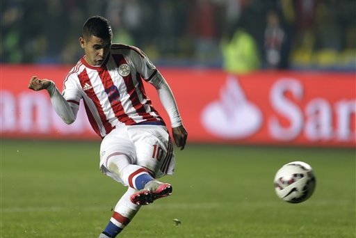 Paraguay's Derlis Gonzalez scores the winning penalty kick during a Copa America quarterfinal soccer match against Brazil at the Ester Roa Rebolledo Stadium in Concepcion, Chile, Saturday, June 27, 2015. (AP Photo/Natacha Pisarenko)