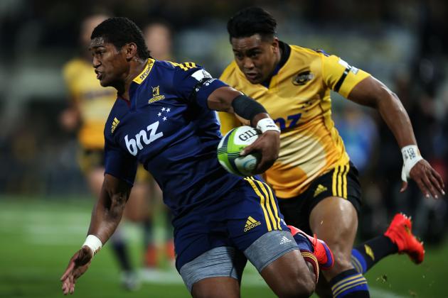 NAPIER, NEW ZEALAND - JUNE 05: Waisake Naholo of the Highlanders (left) tries to escape the oncoming Julian Savea of the Hurricanes (right) chase after the ball during the round 17 Super Rugby match between the Hurricanes and the Highlanders at McLean Park on June 5, 2015 in Napier, New Zealand. (Photo by Joel Ford/Getty Images)