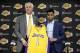 Los Angeles Lakers draft pick D'Angelo Russell, right, and general manager Mitch Kupchak pose for photos during a news conference, Monday, June 29, 2015, in El Segundo, Calif. Russell, the No. 2 NBA draft pick, was joined by fellow draftees Larry Nance Jr. and Anthony Brown. (AP Photo/Jae C. Hong)