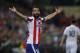 Atletico's Arda Turan reacts during the Champions League quarterfinal first leg soccer match between Atletico Madrid and Real Madrid at the Vicente Calderon stadium in Madrid, Spain, Tuesday, April 14, 2015. (AP Photo/Andres Kudacki)
