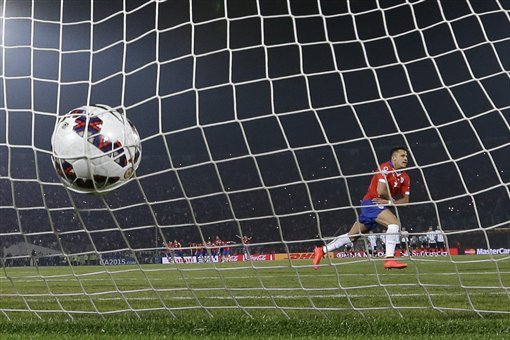 Chile's Alexis Sanchez celebrates after scoring the winning penalty kick against Argentina during the Copa America final soccer match at the National Stadium in Santiago, Chile, Saturday, July 4, 2015. Chile became Copa America champions for the first time after it defeated Argentina in a penalty shootout. (AP Photo/Ricardo Mazalan)