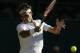 Roger Federer of Switzerland returns a ball to Roberto Bautista Agut of Spain during their singles match against at the All England Lawn Tennis Championships in Wimbledon, London, Monday July 6, 2015. (AP Photo/Alastair Grant)