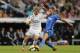 Real Madrid's Martin Odegaard from Norway, left, duels for the ball with Getafe's Lacen, right, during a Spanish La Liga soccer match between Real Madrid and Getafe at the Santiago Bernabeu stadium in Madrid, Spain, Saturday, May 23, 2015. (AP Photo/Daniel Ochoa de Olza)