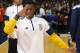 Denver Nuggets guard Nate Robinson jokes with a photographer while Robinson warms up before facing the Toronto Raptors in an NBA basketball game Sunday, Dec. 28, 2014, in Denver. (AP Photo/David Zalubowski)
