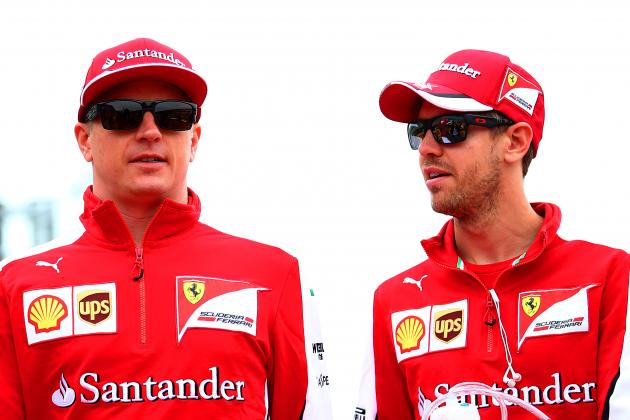 NORTHAMPTON, ENGLAND - JULY 05: Sebastian Vettel of Germany and Ferrari speaks with Kimi Raikkonen of Finland and Ferrari during the drivers' parade before the Formula One Grand Prix of Great Britain at Silverstone Circuit on July 5, 2015 in Northampton, England. (Photo by Mark Thompson/Getty Images)