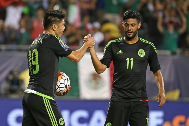CHICAGO, IL - JULY 09: Oribe Peralta #19 of Mexico is congratulated by teammate Carlos Vela #11 after scoring a first half goal against Cuba during a match in the 2015 CONCACAF Gold Cup at Soldier Field on July 9, 2015 in Chicago, Illinois. (Photo by Jonathan Daniel/Getty Images)