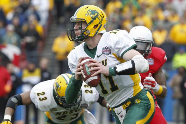 North Dakota State quarterback Carson Wentz (11) carries the ball during the FCS Championship NCAA college football game against Illinois State Saturday, Jan. 10, 2015, in Frisco, Texas.   North Dakota State won the game 29-27 for their fourth straight national championship.  (AP Photo/Tim Sharp)