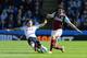 BURNLEY, ENGLAND - APRIL 05: Ryan Mason of Spurs tackles George Boyd of Burnley during the Barclays Premier League match between Burnley and Tottenham Hotspur at Turf Moor on April 5, 2015 in Burnley, England. (Photo by Jan Kruger/Getty Images)