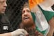 Conor McGregor reacts after defeating Chad Mendes during their interim featherweight title mixed martial arts bout at UFC 189 on Saturday, July 11, 2015, in Las Vegas. (AP Photo/John Locher)