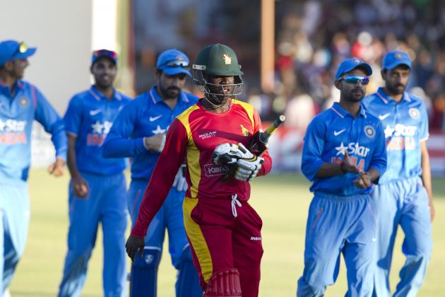 Zimbabwean and Indian cricket players walk off the pitch after the match on the second day of the One Day International  cricket match between the two teams in  Harare, Zimbabwe, Sunday, July,12, 2015.   (AP Photo/Tsvangirayi Mukwazhi)