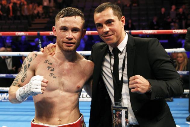 IBF world champion Carl Frampton, left, poses for a photo with WBA world super bantamweight champion Scott Quigg after defeating Chris Avalos of the U.S. during their IBF super bantamweight world boxing title fight at the Odyssey arena in Belfast, Northern Ireland, Saturday, Feb. 28, 2015. (AP Photo/Peter Morrison)