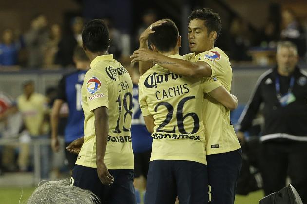 Club America midfielder Francisco Rivera (26) celebrates with forward Andres Andrade as the San Jose Earthquakes mascot tackles a Club America fan after an International Champions Cup soccer match in San Jose, Calif., Tuesday, July 14, 2015. Club America won 2-1. (AP Photo/Jeff Chiu)