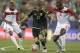 Mexico’s Paul Aguilar (22) drives between Trinidad & Tobago’s Khaleem Hyland (8) and Joevin Jones (3) during the first half of a CONCACAF Gold Cup soccer match in Charlotte, N.C., Wednesday, July 15, 2015. (AP Photo/Gerry Broome)