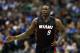 Miami Heat's Luol Deng (9) of Britain jogs up court during an NBA basketball game against the Dallas Mavericks, Sunday, Nov. 9, 2014, in Dallas. (AP Photo/Tony Gutierrez)