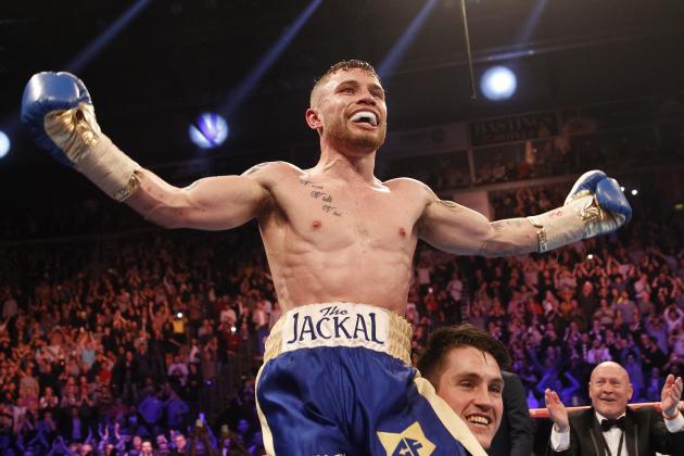 World champion Carl Frampton celebrates with his trainer Shane McGuigan after defeating Chris Avalos of the U.S. during the IBF super bantamweight world boxing title fight at the Odyssey arena, Belfast, Northern Ireland, Saturday, Feb. 28, 2015. (AP Photo/Peter Morrison)