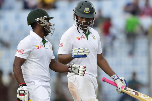 Bangladesh cricketers Tamim Iqbal (R) and Imrul Kayes walk off the field at close of play on the first day of the first Test match between Bangladesh and South Africa at the Zahur Ahmed Chowdhury Stadium in Chittagong on July 21, 2015.  AFP PHOTO/ Munir uz ZAMAN        (Photo credit should read MUNIR UZ ZAMAN/AFP/Getty Images)