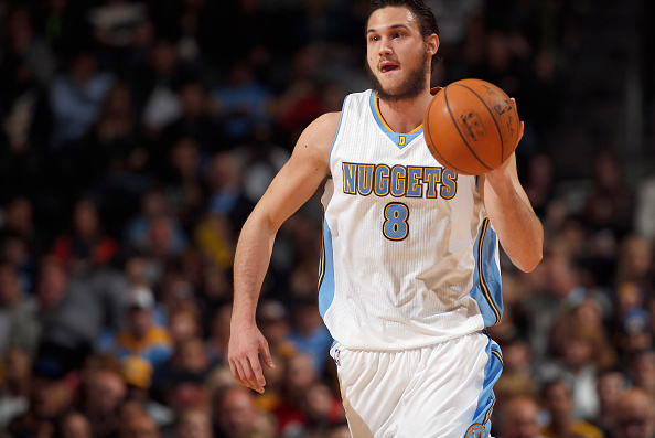 DENVER, CO - APRIL 08: Danilo Gallinari #8 of the Denver Nuggets brings the ball upcourt against the Los Angeles Lakers at Pepsi Center on April 8, 2015 in Denver, Colorado. The Nuggets defeated the Lakers 119-101. NOTE TO USER: User expressly acknowledges and agrees that, by downloading and or using this photograph, User is consenting to the terms and conditions of the Getty Images License Agreement. (Photo by Doug Pensinger/Getty Images)