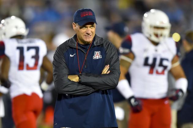 Arizona head coach Rich Rodriguez walks the field before the start of an NCAA college football game against UCLA, Saturday, Nov. 1, 2014, in Pasadena, Calif. (AP Photo/Gus Ruelas)
