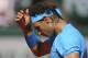 Spain's Rafael Nadal wipes the sweat of his face in the quarterfinal match of the French Open tennis tournament against Serbia's Novak Djokovic at the Roland Garros stadium, in Paris, France, Wednesday, June 3, 2015. (AP Photo/David Vincent)