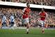 Arsenal's Aaron Ramsey, center, celebrates scoring his side's second goal during the English Premier League soccer match between Arsenal and West Ham United at the Emirates Stadium in London, Saturday, March 14, 2015. (AP Photo/Matt Dunham)