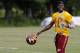 Jun 16, 2015; Ashburn, VA, USA; Washington Redskins quarterback Robert Griffin III (10) walks off the field after day one of Redskins Minicamp at Redskins Park. Mandatory Credit: Geoff Burke-USA TODAY Sports