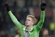 Wolfsburg's Kevin De Bruyne celebrates after scoring his side's thrid goal during the Europa League round of sixteen first leg soccer match between VfL Wolfsburg and FC Internazionale Milano in Wolfsburg, Germany, Thursday, March 12, 2015. (AP Photo/Michael Sohn)