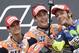 Spain’s Marc Marquez who won, center, Spain’s Dani Pedrosa who came in second, left, and Italy’s Valentino Rossi who finish second shoot a selfie on the podium after the MotoGP race at the Sachsenring circuit in Hohenstein-Ernstthal, Germany, Sunday, July 12, 2015. (AP Photo/Jens Meyer)