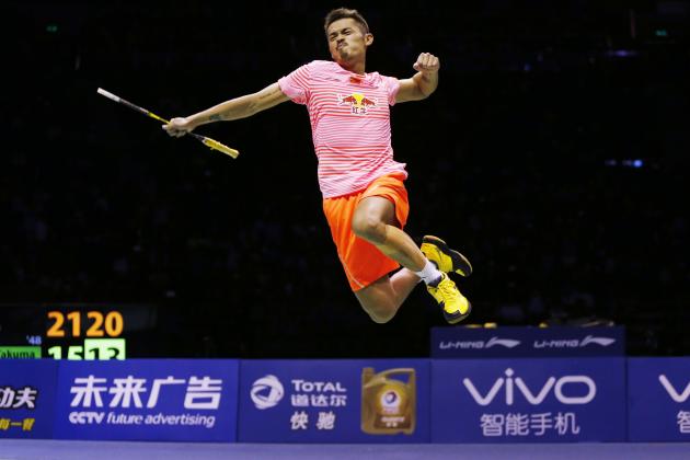China's Lin Dan is airborne as he celebrates his win over Japan's Takuma Ueda in the final's of the Sudirman Cup badminton championships in Dongguan in southern China's Guangdong province, Sunday, May 17, 2015. (AP Photo/Kin Cheung)