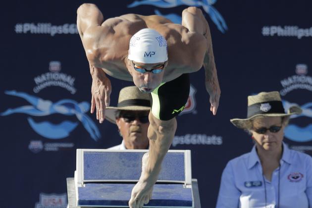 Michael Phelps dives into the pool at the start of the men's 100-meter butterfly final at the the U.S. swimming nationals, Saturday, Aug. 8, 2015, in San Antonio. Phelps won the race. (AP Photo/Eric Gay)