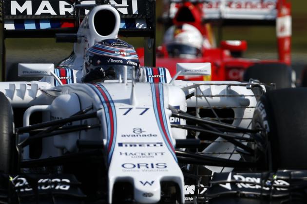 Williams driver Valtteri Bottas from Finland, left steers his car in front of Ferrari driver Sebastian Vettel of Germany during the free practice at the Hungarian Formula One Grand Prix in Budapest, Hungary, Friday, July 24, 2015. The Hungarian Formula One Grand Prix will be held on Sunday July, 26. (AP Photo/Darko Vojinovic)