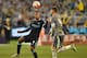 Raheem Sterling, left, of Manchester City and Sergio Ramos of Real Madrid contest for the ball during their International Championship Cup soccer match in Melbourne, Australia, Friday, July 24, 2015. (AP Photo/Theo Karanikos)