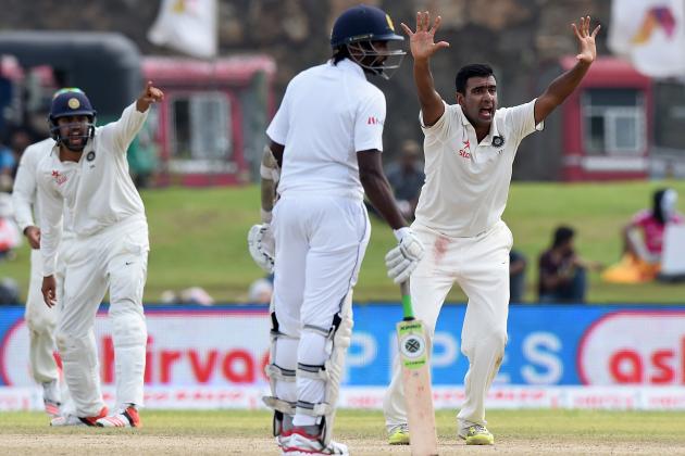 Indian cricketer Ravichandran Ashwin (R) successfully appeals for a Leg Before Wicket (LBW) decision against Sri Lankan cricketer Rangana Herath during the first day of the opening Test match between Sri Lanka and India at the Galle International Cricket Stadium in Galle on August 12, 2015. AFP PHOTO/ Ishara S. KODIKARA        (Photo credit should read Ishara S.KODIKARA/AFP/Getty Images)