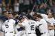 Aug 11, 2015; Seattle, WA, USA; Seattle Mariners right fielder Logan Morrison (20, middle left) is doused by first baseman Jesus Montero (63, right) as he picks up center fielder Austin Jackson (16, legs) after a game-winning RBI-single by Jackson against the Baltimore Orioles during the tenth inning at Safeco Field. Seattle defeated Baltimore, 6-5. Mandatory Credit: Joe Nicholson-USA TODAY Sports