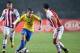 Brazil's midfielder Philippe Coutinho (C) is marked by Paraguay's forward Edgar Benitez (L) and defender Ivan Piris during their 2015 Copa America football championship quarter-final match, in Concepcion, Chile, on June 27, 2015. AFP PHOTO / YURI CORTEZ (Photo credit should read YURI CORTEZ/AFP/Getty Images)