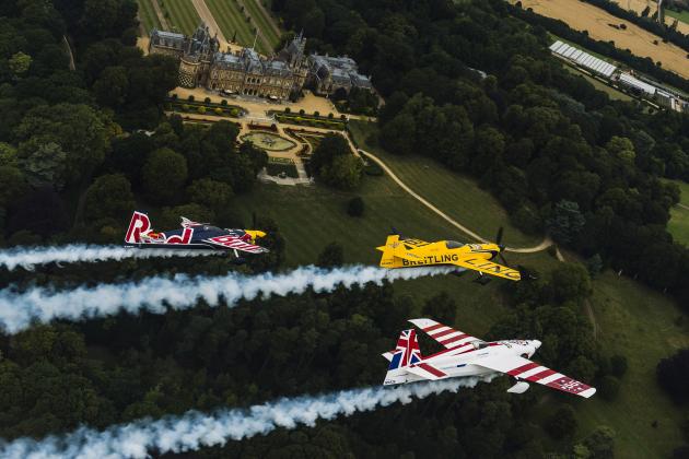 OXFORD, ENGLAND - AUGUST 11: (EDITORIAL USE ONLY)  In this handout photo provided by Red Bull, Nigel Lamb and Paul Bohomme of Great Britain give Peter Besenyei of Hungary an aerial view of their home country ahead of the weekend's Red Bull Air Race World Championship stop in Ascot over the Waddesdon Manor in the heart of the Buckinghamshire countryside near Oxford in the United Kingdom on August 11, 2015.  (Photo by Armin Walcher/Red Bull via Getty Images)