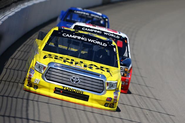 BROOKLYN, MI - AUGUST 15:  Kyle Busch, driver of the #51 Dollar General Toyota, leads a pack of trucks during the NASCAR Camping World Truck Series Careers for Veterans 200 at Michigan International Speedway on August 15, 2015 in Brooklyn, Michigan.  (Photo by Rey Del Rio/Getty Images)
