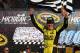 BROOKLYN, MI - AUGUST 16: Matt Kenseth, driver of the #20 Dollar General Toyota, celebrates in victory lane after winning the NASCAR Sprint Cup Series Pure Michigan 400 at Michigan International Speedway on August 16, 2015 in Brooklyn, Michigan. (Photo by Sarah Crabill/Getty Images)